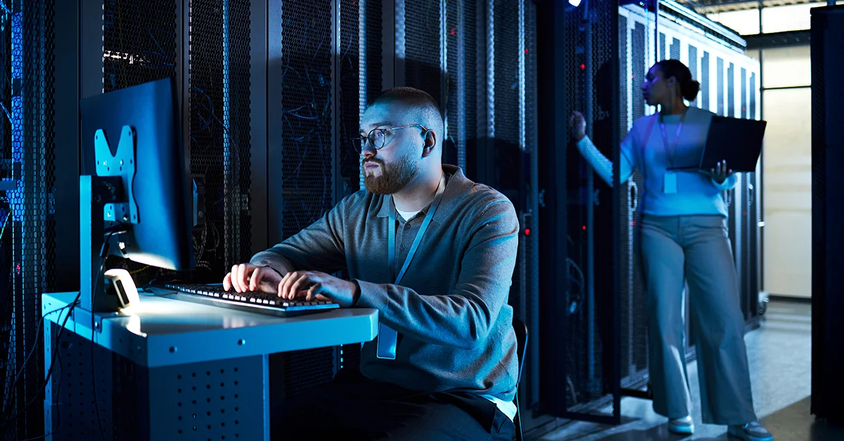 Cyber Security Technicians Working in a Server Room